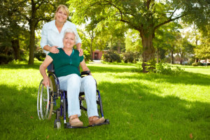 caregiver and senior woman smiling