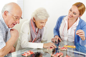 caregiver assisting elders of their activities